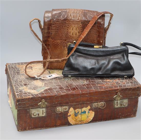 A small crocodile case and two handbags